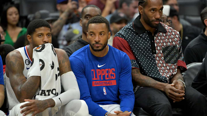Oct 30, 2022; Los Angeles, California, USA; Los Angeles Clippers guard Paul George (13) forward Norman Powell (24) and forward Kawhi Leonard (2) watch from the bench during the fourth quarter against the New Orleans Pelicans at Crypto.com Arena. Mandatory Credit: Jayne Kamin-Oncea-Imagn Images Oct 30, 2022; Los Angeles, California, USA; Los Angeles Clippers guard Paul George (13) forward Norman Powell (24) and forward Kawhi Leonard (2) watch from the bench during the fourth quarter against the New Orleans Pelicans at Crypto.com Arena. Mandatory Credit: Jayne Kamin-Oncea-Imagn Images