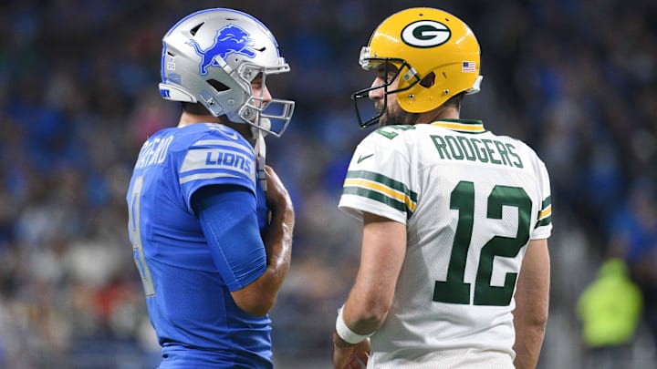 Oct 7, 2018; Detroit, MI, USA; Detroit Lions quarterback Matthew Stafford (9) and Green Bay Packers quarterback Aaron Rodgers (12) chat during the first quarter at Ford Field.