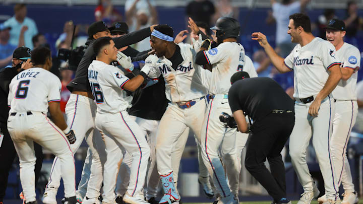 Miami, Florida, USA; Miami Marlins right fielder Jesus Sanchez (7) celebrates with teammates after hitting a walk-off triple against the Chicago Cubs at loanDepot Park.