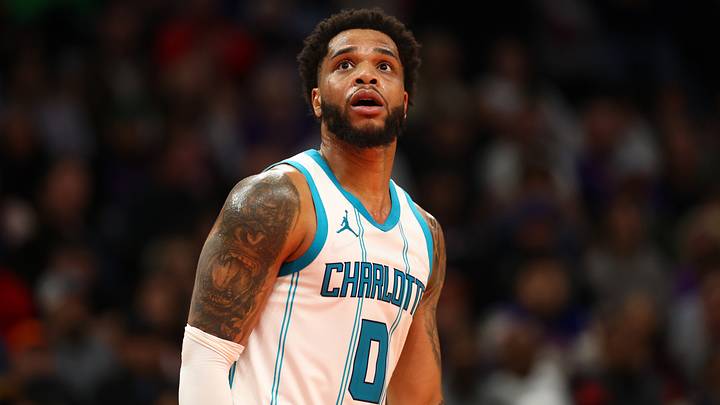 Jan 12, 2025; Phoenix, Arizona, USA; Charlotte Hornets forward Miles Bridges (0) against the Phoenix Suns at Footprint Center. Mandatory Credit: Mark J. Rebilas-Imagn Images