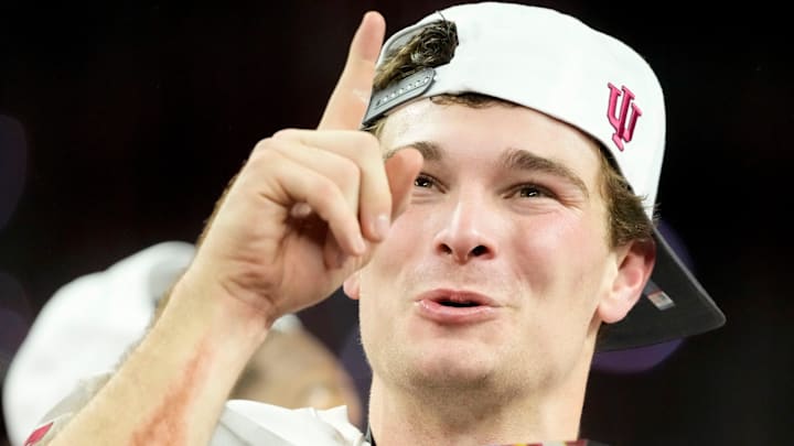 Indiana Hoosiers quarterback Fernando Mendoza (15) holds the MVP trophy on Sunday, Dec. 7, 2025, after winning the Big Ten football championship against the Ohio State Buckeyes at Lucas Oil Stadium in Indianapolis. Indiana Hoosiers quarterback Fernando Mendoza (15) holds the MVP trophy on Sunday, Dec. 7, 2025, after winning the Big Ten football championship against the Ohio State Buckeyes at Lucas Oil Stadium in Indianapolis.