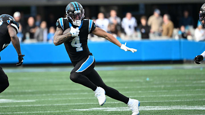 Dec 21, 2025; Charlotte, North Carolina, USA; Carolina Panthers wide receiver Tetairoa McMillan (4) with the ball in the third quarter at Bank of America Stadium. Mandatory Credit: Bob Donnan-Imagn Images