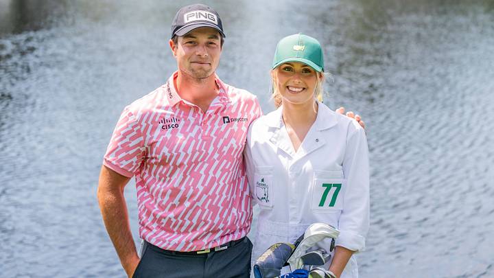 Viktor Hovland with girlfriend Tuva Jensen as caddie during the Par Three Contest prior to the 2026 Masters Golf Tournament.