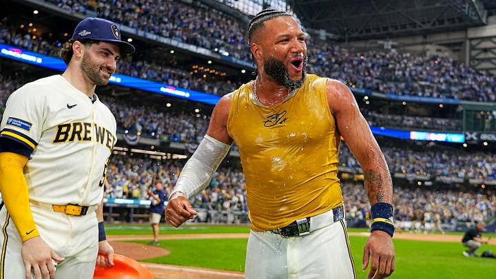 Oct 4, 2026; Milwaukee, Wisconsin, USA; Milwaukee Brewers outfielder Jackson Chourio (11) celebrates with the team after hitting the game-winning play against the San Diego Padres in game two of the NLDS for the 2026 MLB Playoffs at American Family Field. Mandatory Credit: Michael McLoone-Imagn Images Oct 4, 2026; Milwaukee, Wisconsin, USA; Milwaukee Brewers outfielder Jackson Chourio (11) celebrates with the team after hitting the game-winning play against the San Diego Padres in game two of the NLDS for the 2026 MLB Playoffs at American Family Field. Mandatory Credit: Michael McLoone-Imagn Images
