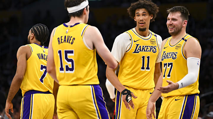 Los Angeles Lakers guard Luka Doncic (77) celebrates with center Jaxson Hayes (11), and guard Austin Reaves (15) after scoring against the Houston Rockets during the first half at Crypto.com Arena.