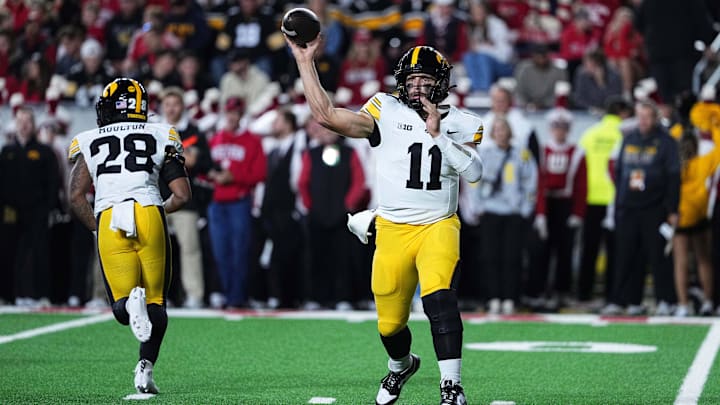 Oct 11, 2025; Madison, Wisconsin, USA; Iowa Hawkeyes quarterback Mark Gronowski (11) attempts a pass in the second quarter against the Wisconsin Badgers at Camp Randall Stadium. Mandatory Credit: Ross Harried-Imagn Images
