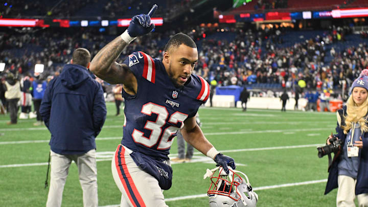 Jan 11, 2026; Foxborough, MA, USA; New England Patriots running back Treveyon Henderson (32) jogs off the field after defeating the Los Angeles Chargers in an AFC Wild Card Round game at Gillette Stadium. Mandatory Credit: Eric Canha-Imagn Images