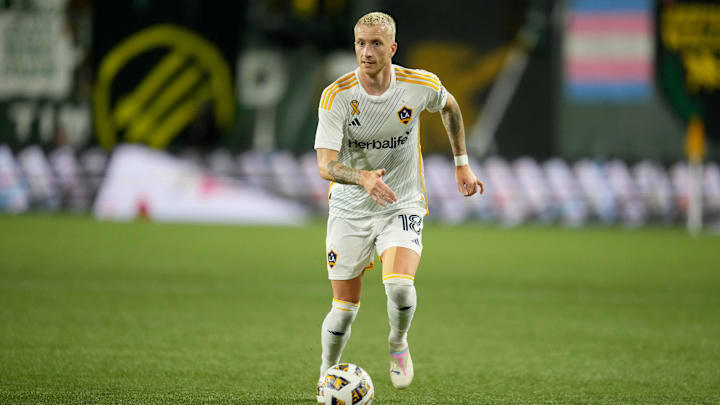 Sep 18, 2024; Portland, Oregon, USA; LA Galaxy midfielder Marco Reus (18) runs with the ball during the second half against the Portland Timbers at Providence Park. Mandatory Credit: Soobum Im-Imagn Images
