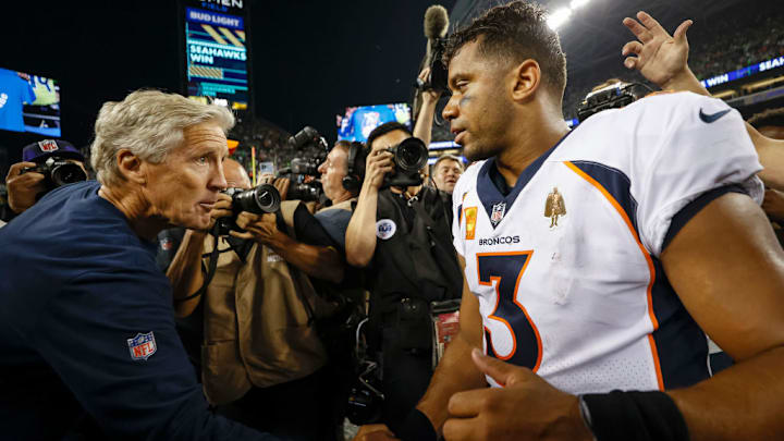 SEATTLE, WASHINGTON - SEPTEMBER 12: Head coach Pete Carroll of the Seattle Seahawks and Russell Wilson #3 of the Denver Broncos shake hands after their game at Lumen Field on September 12, 2022 in Seattle, Washington.