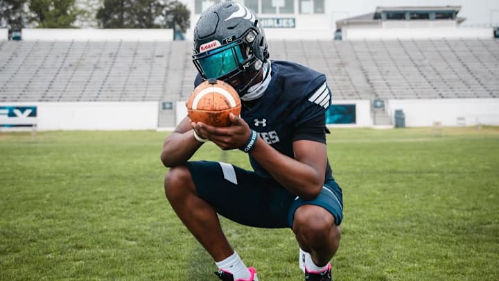 Faizon Brandon taking pictures in his Grimsley High School football jersey Faizon Brandon taking pictures in his Grimsley High School football jersey