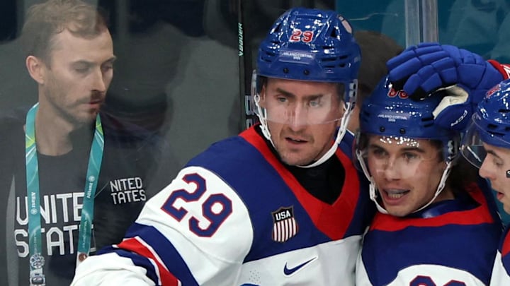 [US, Mexico & Canada customers only] Feb 12, 2026; Milan, Italy; Brock Nelson of United States celebrates scoring their second goal with Jack Hughes of United States and Brock Faber of United States against Latvia  in men's ice hockey group C play during the Milano Cortina 2026 Olympic Winter Games at Milano Santagiulia Ice Hockey Arena. Mandatory Credit: Mike Segar/Reuters via Imagn Images