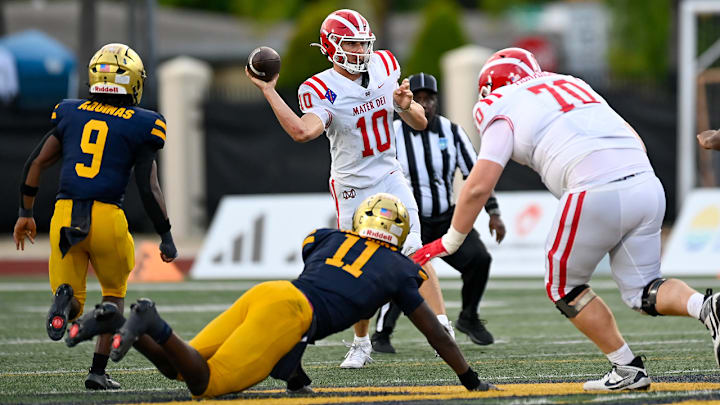 Mater Dei quarterback Ryan Hopkins leans into a passing lane during his team's win over St. Thomas Aquinas at the 2025 Broward County National Football Showcase. Mater Dei prevailed 26-23 to hold on to the No. 1 spot in the California High School state rankings after Week 0 games. 