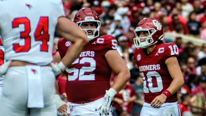 Oklahoma offensive lineman Troy Everett, quarterback John Mateer