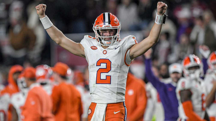 Nov 25, 2023; Columbia, South Carolina, USA; Clemson Tigers quarterback Cade Klubnik (2) raises his arms as time runs out against the South Carolina Gamecocks at Williams-Brice Stadium. Clemson won 16-7 Nov 25, 2023; Columbia, South Carolina, USA; Clemson Tigers quarterback Cade Klubnik (2) raises his arms as time runs out against the South Carolina Gamecocks at Williams-Brice Stadium. Clemson won 16-7