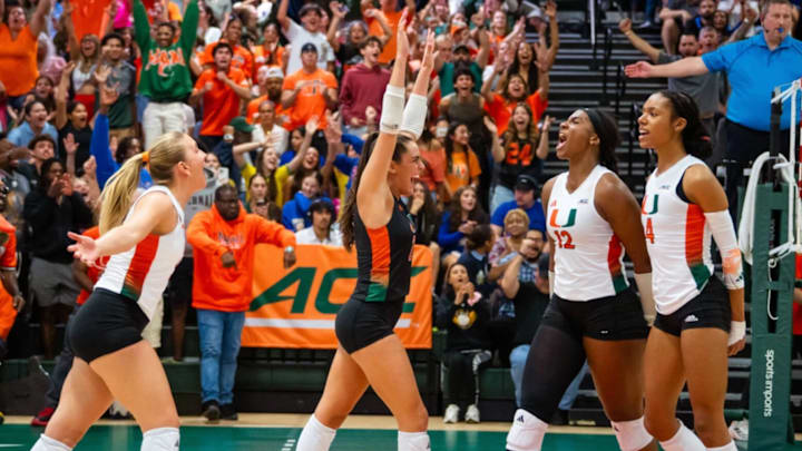 Miami Hurricanes Volleyball celebrating win over No. 4 Pitt