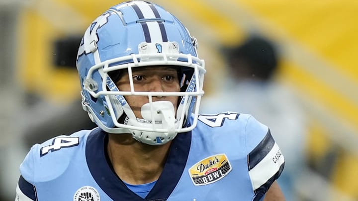 Dec 30, 2021; Charlotte, NC, USA; North Carolina Tar Heels running back Caleb Hood (4) during the first quarter against the South Carolina Gamecocks at Bank of America Stadium. Mandatory Credit: Jim Dedmon-Imagn Images