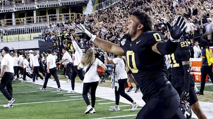 Oct 5, 2024; Nashville, Tennessee, USA;  Vanderbilt Commodores defensive lineman Aeneas DiCosmo (0) runs onto the field in celebrations after defeating the Alabama Crimson Tide at FirstBank Stadium. Mandatory Credit: Butch Dill-Imagn Images