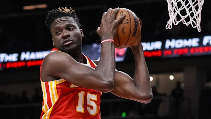 Dec 13, 2021; Atlanta, Georgia, USA; Atlanta Hawks center Clint Capela (15) gets a rebound against the Houston Rockets during the first half at State Farm Arena. Mandatory Credit: Dale Zanine-Imagn Images