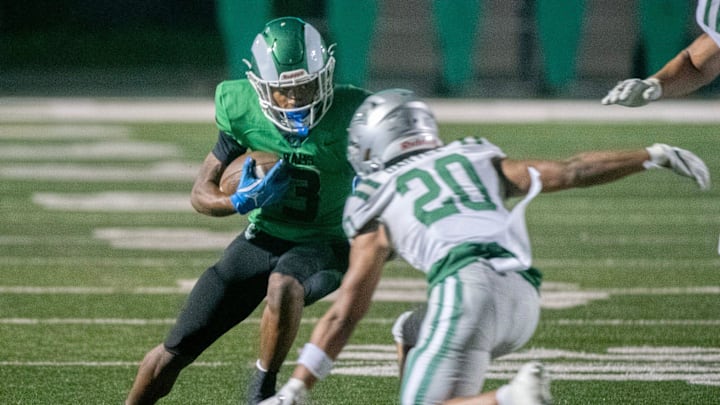 St. Mary’s Kenneth Moore III, left, makes a move into De Las Salle’s Jacob Dartez during a during a varsity football game at St. Mary’s in Stockton on Sep. 20, 2024. De La Salle won 38-35.