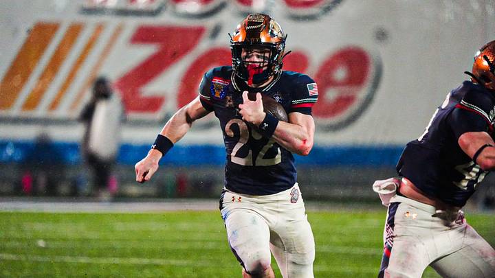 Navy’s Eli Heidenreich (22) rushes with the ball during the Liberty Bowl game against the Cincinnati Bearcats on Jan. 2, 2026 at Simmons Bank Liberty Stadium in Memphis, Tenn. Navy’s Eli Heidenreich (22) rushes with the ball during the Liberty Bowl game against the Cincinnati Bearcats on Jan. 2, 2026 at Simmons Bank Liberty Stadium in Memphis, Tenn.