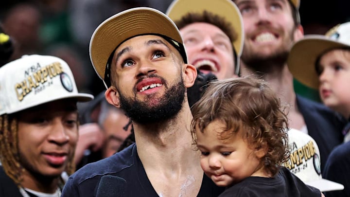 Jun 17, 2024; Boston, Massachusetts, USA; Boston Celtics guard Derrick White (9) celebrates after beating the Dallas Mavericks in game five of the 2024 NBA Finals to win the NBA Championship at TD Garden. Mandatory Credit: Peter Casey-Imagn Images Jun 17, 2024; Boston, Massachusetts, USA; Boston Celtics guard Derrick White (9) celebrates after beating the Dallas Mavericks in game five of the 2024 NBA Finals to win the NBA Championship at TD Garden. Mandatory Credit: Peter Casey-Imagn Images