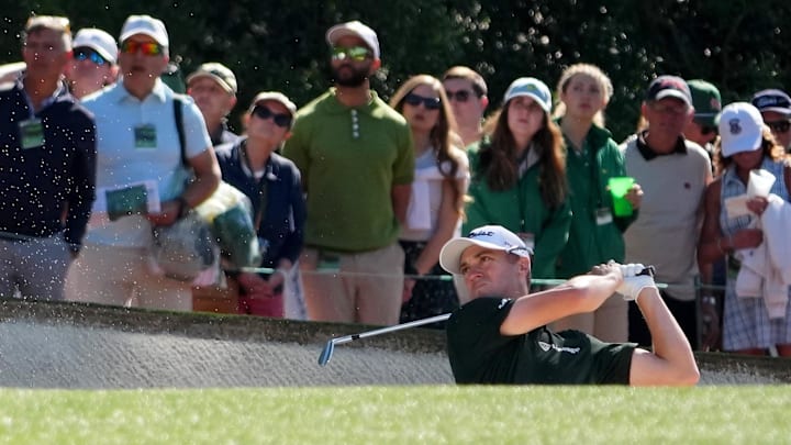 Apr 10, 2026; Augusta, Georgia, USA; Justin Thomas plays a shot from a bunker on the first hole during the second round of the Masters Tournament at Augusta National Golf Club. Apr 10, 2026; Augusta, Georgia, USA; Justin Thomas plays a shot from a bunker on the first hole during the second round of the Masters Tournament at Augusta National Golf Club.