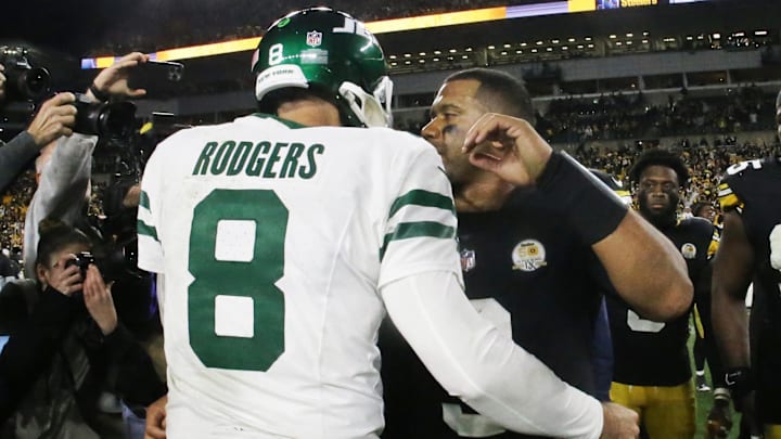 Oct 20, 2024; Pittsburgh, Pennsylvania, USA;  New York Jets quarterback Aaron Rodgers (8) and Pittsburgh Steelers quarterback Russell Wilson (right) greet each other after their game at Acrisure Stadium. Mandatory Credit: Charles LeClaire-Imagn Images
