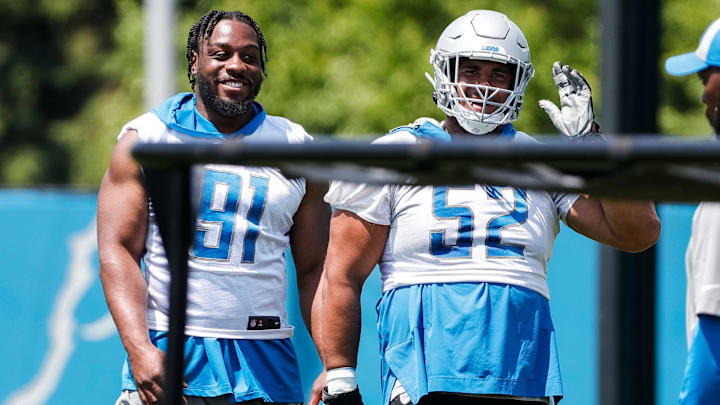 Detroit Lions defensive end Levi Onwuzurike (91) talks to defensive lineman Christian Covington (52) during OTAs at Detroit Lions headquarters in Allen Park on Thursday, June 1, 2023.