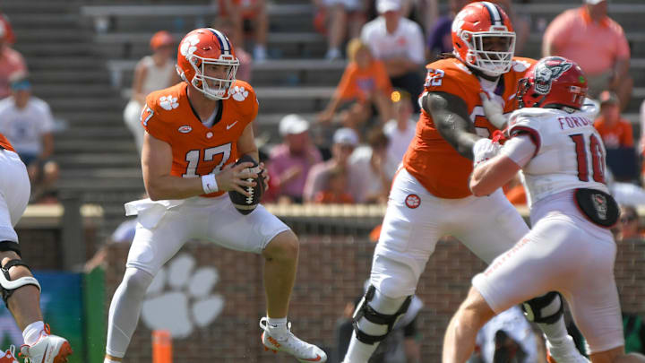 Sep 21, 2024; Clemson, South Carolina, USA; Clemson Tigers quarterback Christopher Vizzina (17) runs against North Carolina State Wolfpack linebacker Caden Fordham (10) during the third quarter at Memorial Stadium. Mandatory Credit: Ken Ruinard-Imagn Images