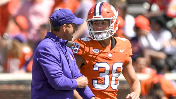 Clemson head coach Dabo Swinney talks with Clemson kicker Robert Gunn III (38) during the Spring football game in Clemson, S.C. Saturday, April 6, 2024. Clemson head coach Dabo Swinney talks with Clemson kicker Robert Gunn III (38) during the Spring football game in Clemson, S.C. Saturday, April 6, 2024.
