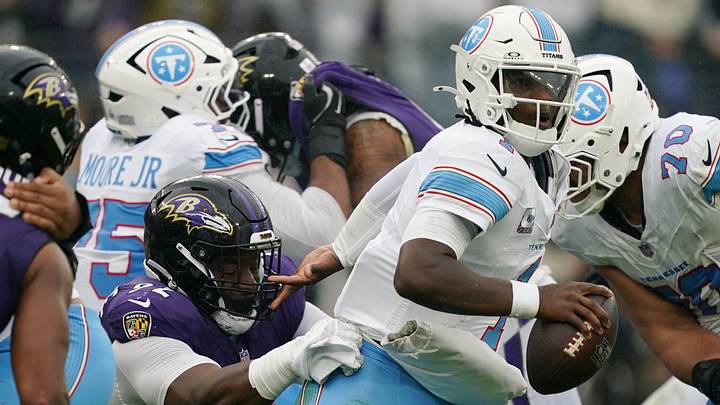 Oct 4, 2026; Baltimore, Maryland, USA; Tennessee Titans quarterback Cam Ward (1) tries to evade Baltimore Ravens linebacker Zion Young (9) during the third quarter at M&T Bank Stadium. Mandatory Credit: Mitch Stringer-Imagn Images Oct 4, 2026; Baltimore, Maryland, USA; Tennessee Titans quarterback Cam Ward (1) tries to evade Baltimore Ravens linebacker Zion Young (9) during the third quarter at M&T Bank Stadium. Mandatory Credit: Mitch Stringer-Imagn Images