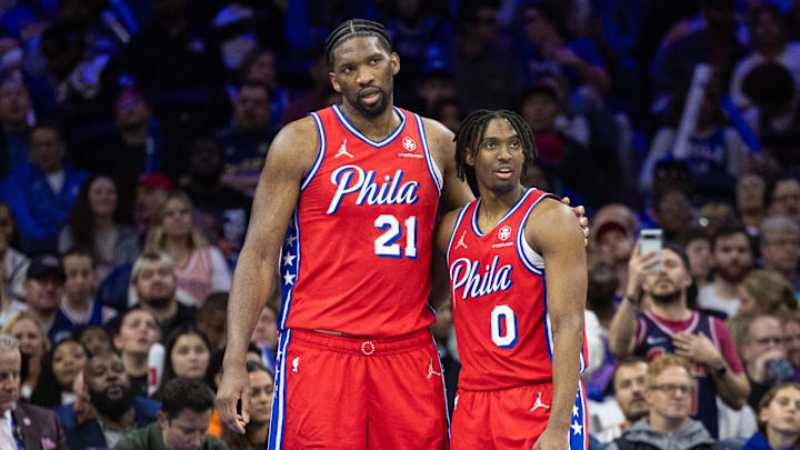 Apr 12, 2024; Philadelphia, Pennsylvania, USA; Philadelphia 76ers center Joel Embiid (21) and guard Tyrese Maxey (0) stand together during a break in action in the fourth quarter against the Orlando Magic at Wells Fargo Center. Mandatory Credit: Bill Streicher-Imagn Images