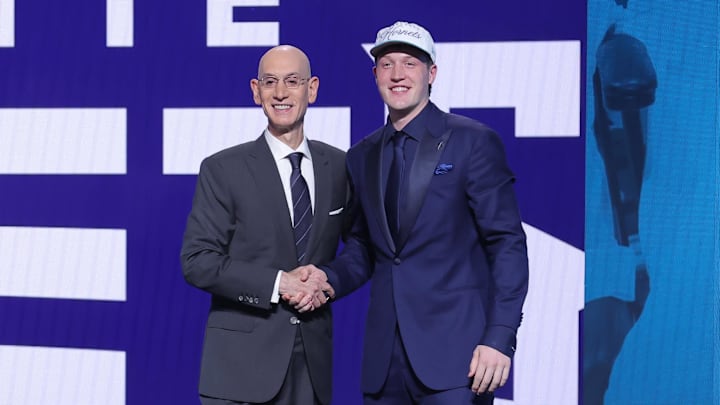 Jun 25, 2025; Brooklyn, NY, USA;  Kon Knueppel stands with NBA commissioner Adam Silver after being selected as the fourth pick by the Charlotte Hornets in the first round of the 2025 NBA Draft at Barclays Center. Mandatory Credit: Brad Penner-Imagn Images