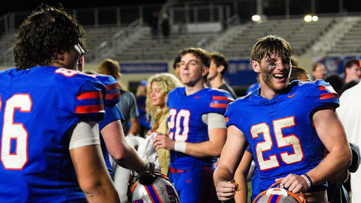 Bolles running back Xander Edwards (25) celebrates the Bulldogs' win over Cardinal Gibbons in the FHSAA Class 2A semifinal at Bolles School in Jacksonville on Dec. 5, 2025. Bolles will take on Sarasota Cardinal Mooney for the state title on Wednesday, Dec. 10, in Miami,