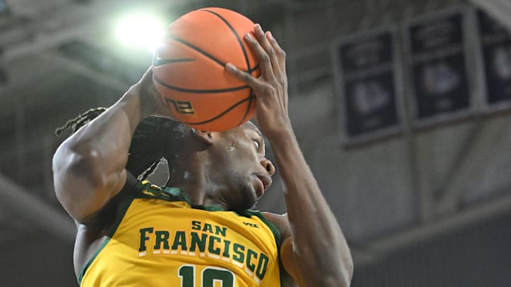 Jan 25, 2024; Spokane, Washington, USA; San Francisco Dons forward Jonathan Mogbo (10) rebounds the