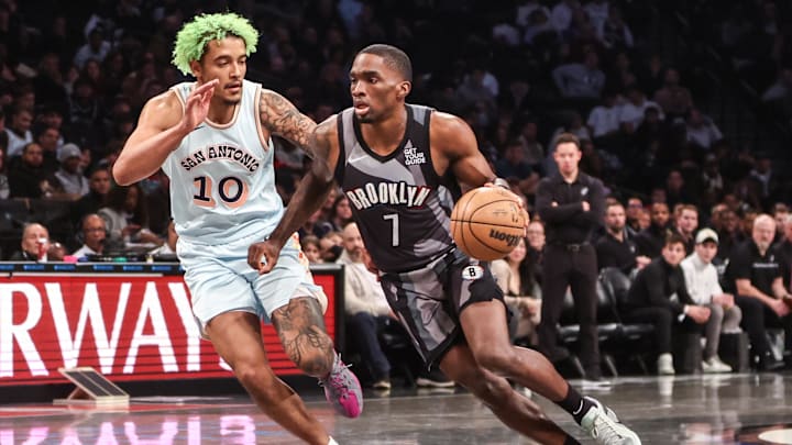 Dec 27, 2024; Brooklyn, New York, USA; Brooklyn Nets guard Shake Milton (7) drives past San Antonio Spurs forward Jeremy Sochan (10) in the third quarter at Barclays Center. Mandatory Credit: Wendell Cruz-Imagn Images Dec 27, 2024; Brooklyn, New York, USA; Brooklyn Nets guard Shake Milton (7) drives past San Antonio Spurs forward Jeremy Sochan (10) in the third quarter at Barclays Center. Mandatory Credit: Wendell Cruz-Imagn Images