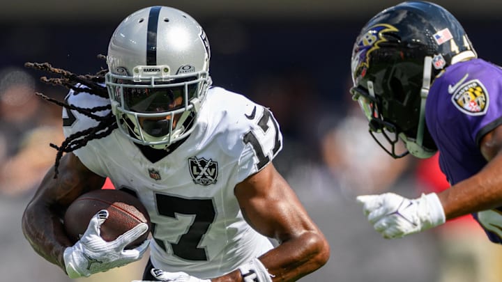 Sep 15, 2024; Baltimore, Maryland, USA; Las Vegas Raiders wide receiver Davante Adams (17) runs with the ball as Baltimore Ravens cornerback Marlon Humphrey (44) defends during the second half at M&T Bank Stadium. Mandatory Credit: Reggie Hildred-Imagn Images