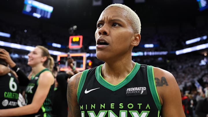 Oct 18, 2024; Minneapolis, Minnesota, USA; Minnesota Lynx guard Courtney Williams (10) celebrates her teams win after game four of the 2024 WNBA Finals against the New York Liberty at Target Center. Mandatory Credit: Matt Krohn-Imagn Images