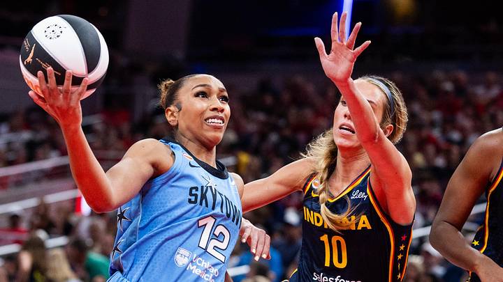 Jun 11, 2026; Indianapolis, Indiana, USA; Chicago Sky guard Sydney Taylor (12) shoots the ball while Indiana Fever guard Lexie Hull (10) defends in the first half at Gainbridge Fieldhouse. Mandatory Credit: Trevor Ruszkowski-Imagn Images Jun 11, 2026; Indianapolis, Indiana, USA; Chicago Sky guard Sydney Taylor (12) shoots the ball while Indiana Fever guard Lexie Hull (10) defends in the first half at Gainbridge Fieldhouse. Mandatory Credit: Trevor Ruszkowski-Imagn Images