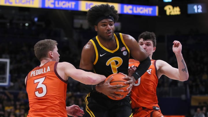 Pittsburgh Panthers Blake Hinson (2) gets fouled by Virginia Tech Hokies Sean Pedulla (3) while going for a layup during the first half on February 24, 2024 at the Petersen Events Center in Pittsburgh, PA.