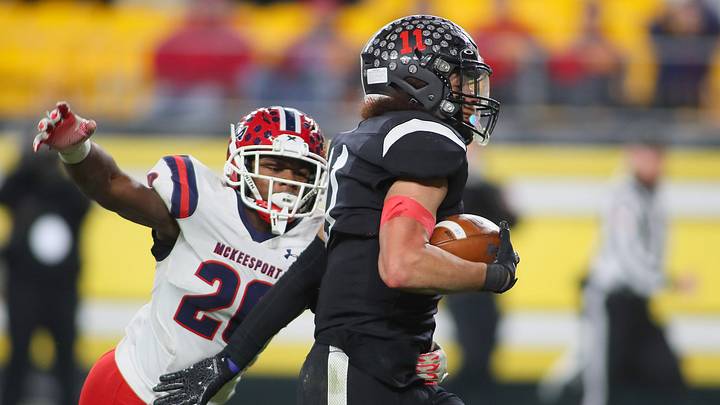 Aliquippa's Cameron Lindsey (11) pushes away from McKeesport's Kemon Spell (20) during the first half of the WPIAL 4A Championship game Friday evening at Acrisure Stadium in Pittsburgh, PA. Aliquippa's Cameron Lindsey (11) pushes away from McKeesport's Kemon Spell (20) during the first half of the WPIAL 4A Championship game Friday evening at Acrisure Stadium in Pittsburgh, PA.