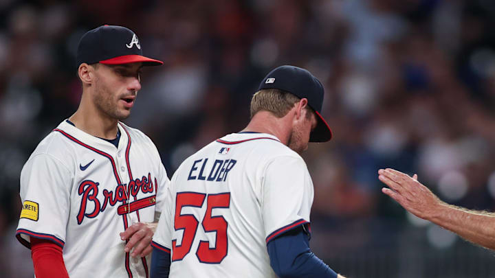 Sep 8, 2025; Atlanta, Georgia, USA; Atlanta Braves manager Brian Snitker (43) removes starting pitcher Bryce Elder (55) from a game against the Chicago Cubs as first baseman Matt Olson (28) looks on in the seventh inning at Truist Park. Mandatory Credit: Brett Davis-Imagn Images
