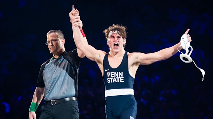 Penn State's Tyler Kasak celebrates a victory over Iowa's Jacori Teemer in their Big Ten dual match at the Bryce Jordan Center in January. 