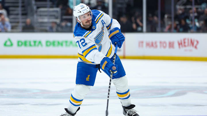 Mar 4, 2026; Seattle, Washington, USA; St. Louis Blues defenseman Justin Faulk (72) attempts a shot on goal in the first period against the Seattle Kraken at Climate Pledge Arena. Mandatory Credit: Kevin Ng-Imagn Images