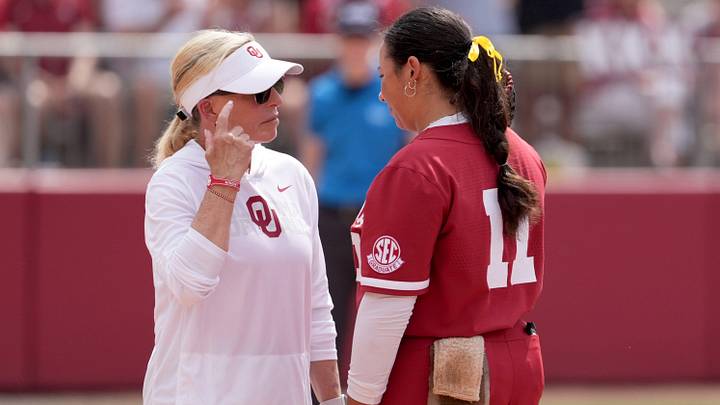 Oklahoma head softball coach Patty Gasso talks with Kierston Deal (11) during the NCAA Norman Softball Regional game between the University of Oklahoma Sooners and Michigan Wolverines at Love's Field in Norman, Okla., May, 17, 2026.