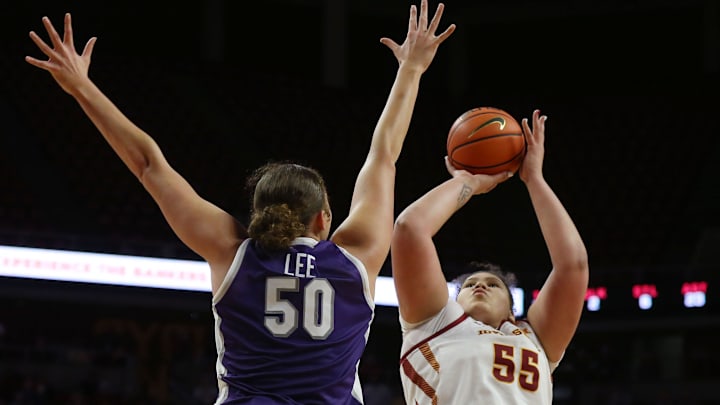 Iowa State Cyclones center Audi Crooks (55) takes a shot over Kansas State Wildcats forward Ayoka Lee (50).