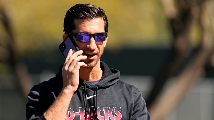 Mar 15, 2022; Scottsdale, Arizona, USA; Arizona Diamondbacks general manager Mike Hazen talks on his phone during spring training at Salt River Fields.

Mlb Diamondbacks Spring Training