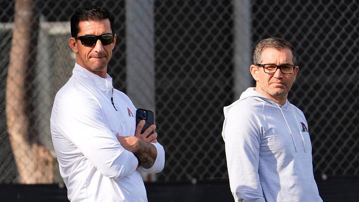 Arizona Diamondbacks Executive Vice President and General Manager Mike Hazen talks with Senior Vice President & Assistant General Manager Amiel Sawdaye (right) during spring training practice at Salt River Fields at Talking Stick in Scottsdale on Feb. 13, 2025.
