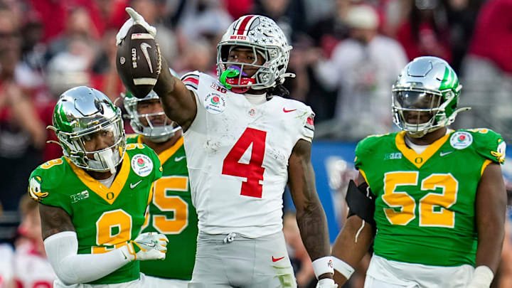 Ohio State Buckeyes wide receiver Jeremiah Smith (4) celebrates a first down catch during the second half of the College Football Playoff quarterfinal against the Oregon Ducks at the Rose Bowl in Pasadena, Calif. on Jan. 1, 2025. Ohio State won 41-21.