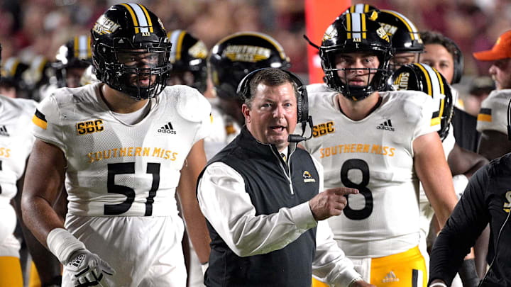 Sep 9, 2023; Tallahassee, Florida, USA; Southern Miss Golden Eagles head coach Will Hall speaks to his team during a timeout in the first half against the Florida State Seminoles at Doak S. Campbell Stadium. Mandatory Credit: Melina Myers-Imagn Images
